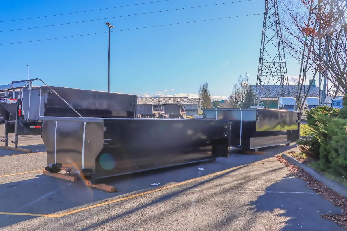 Roll-off dumpster ready for waste disposal at job site for 2 Yard Dumpster Rental in Johnson City